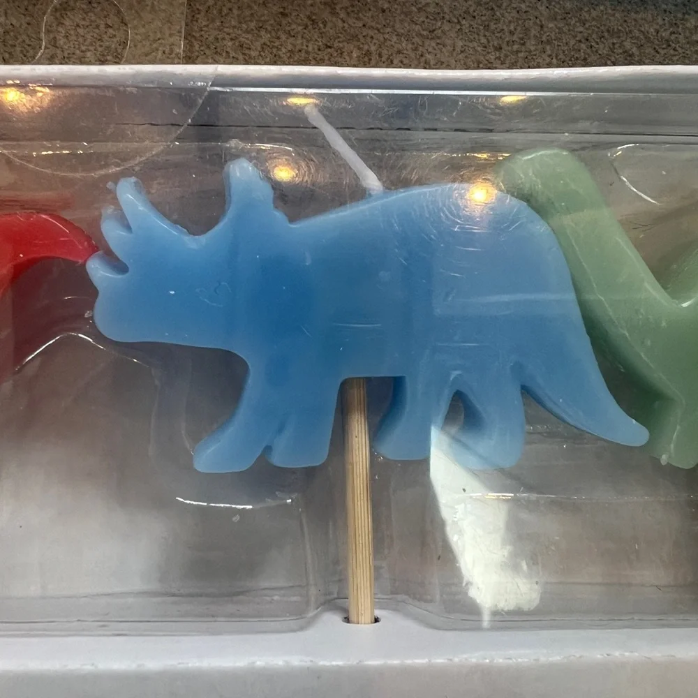 NWT Dinosaur Birthday Candles Set - each set has 4 candles approx 1”x2” each. 🦕